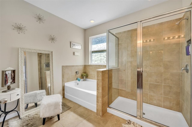 bathroom with tile flooring and independent shower and bath