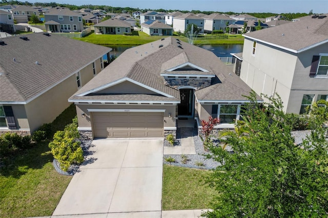 view of front facade featuring a garage and a front yard