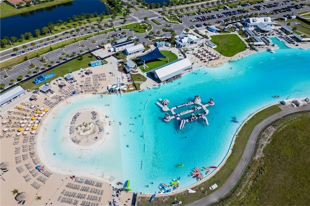 birds eye view of property with a water view