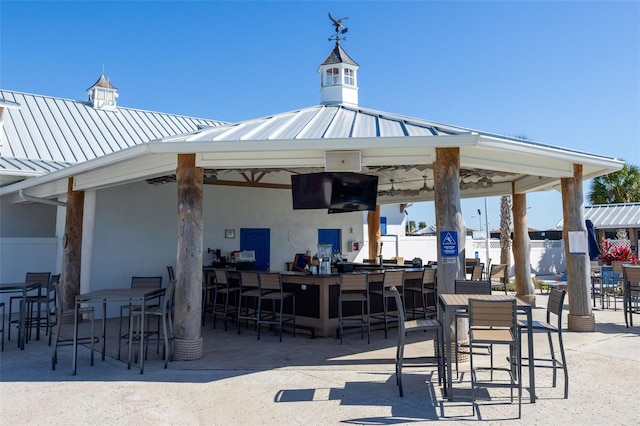 exterior space featuring a gazebo and a bar