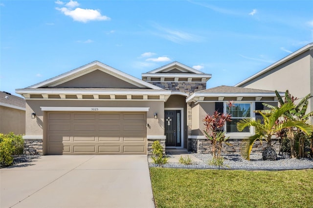 view of front of home with a garage and a front yard