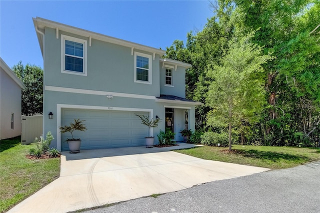 view of front of property with a garage and a front yard