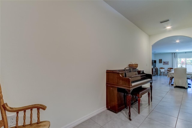 misc room with light tile patterned floors