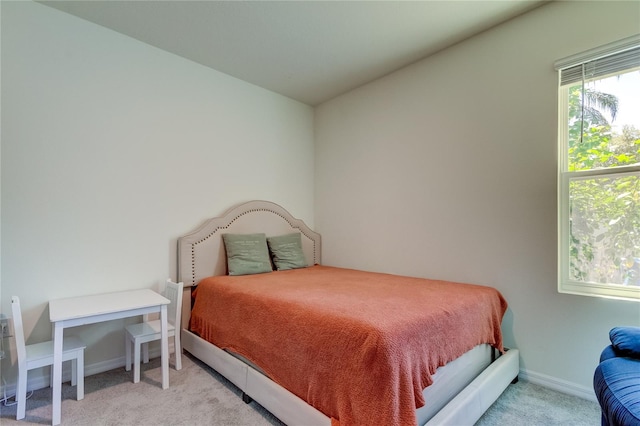 bedroom with light colored carpet