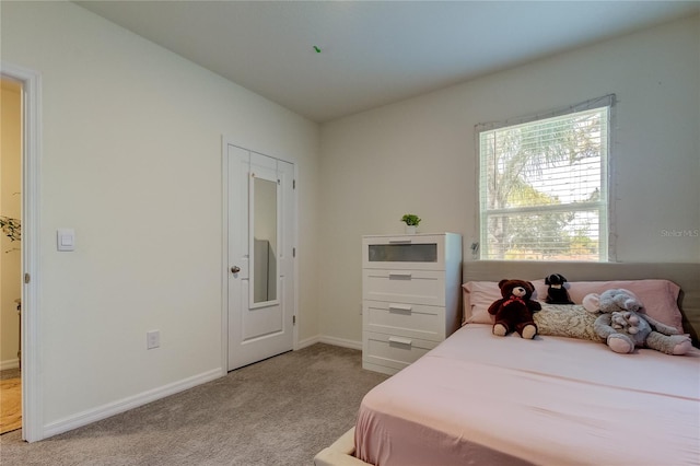 bedroom with light colored carpet