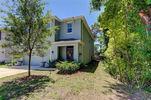 view of front facade featuring a garage and a front yard