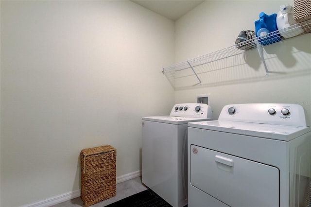 washroom with washing machine and dryer