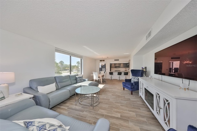 living room with a textured ceiling