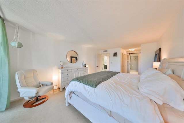 carpeted bedroom with a textured ceiling