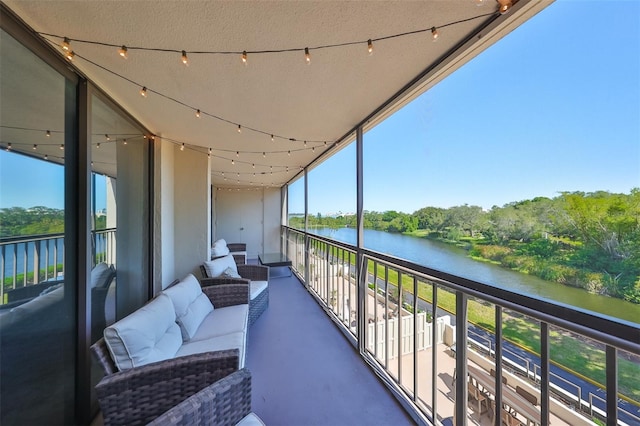 balcony featuring a water view