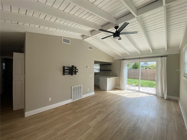 unfurnished living room featuring vaulted ceiling with beams, light wood-type flooring, and ceiling fan