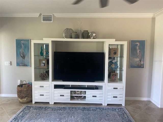 unfurnished living room featuring ornamental molding and tile patterned flooring