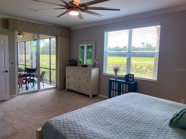 carpeted bedroom with multiple windows, access to exterior, and ceiling fan