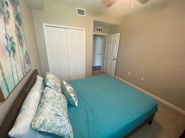 carpeted bedroom featuring a closet and ceiling fan