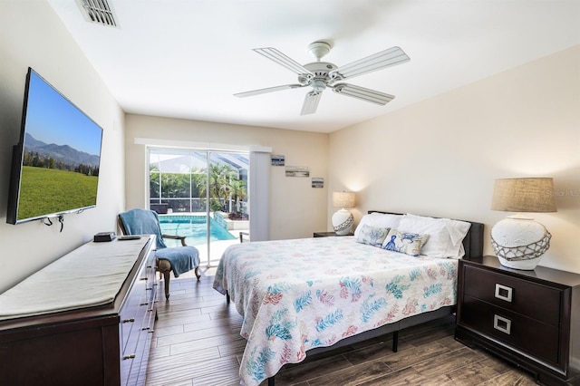 bedroom with access to outside, dark wood-type flooring, and ceiling fan