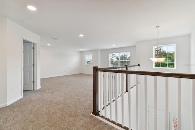 corridor featuring carpet floors