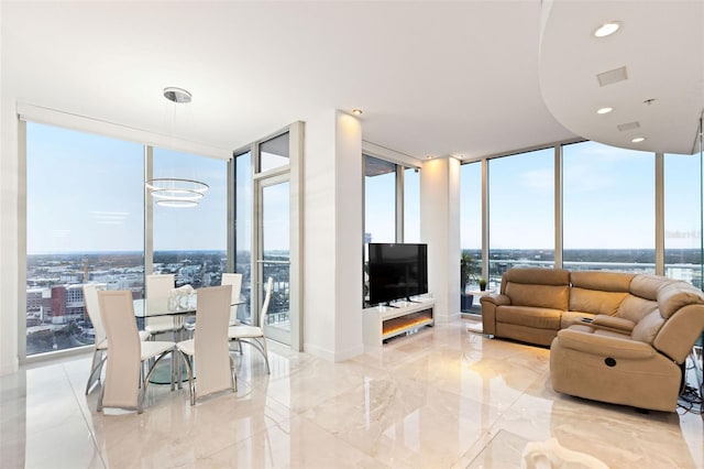 living room with floor to ceiling windows