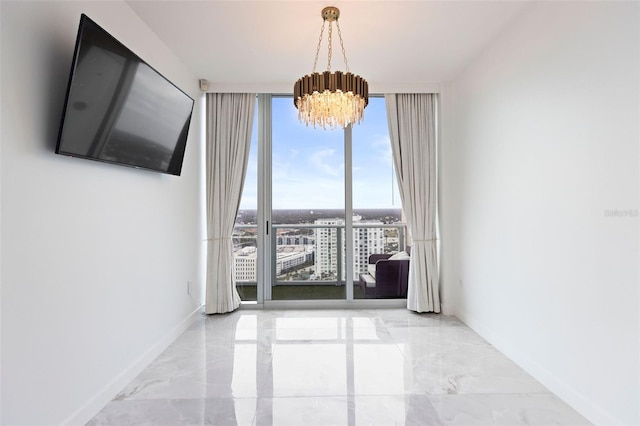 interior space featuring floor to ceiling windows and a notable chandelier