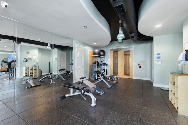 gym featuring french doors