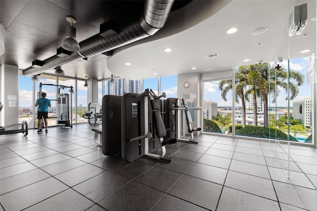 workout area with a wall of windows