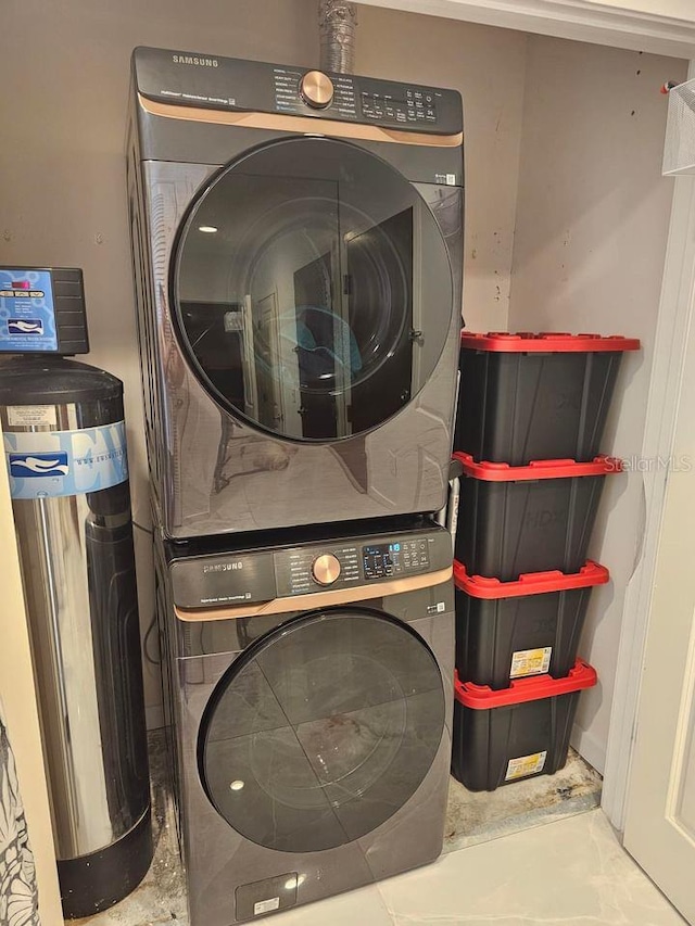 washroom with stacked washer and clothes dryer