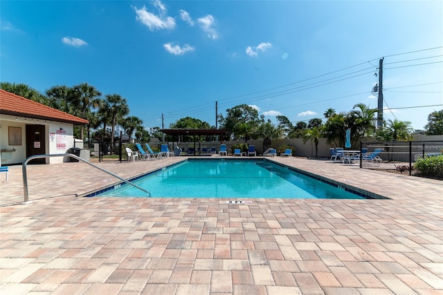 view of swimming pool with a patio