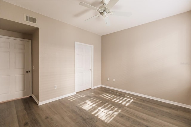 unfurnished bedroom with dark hardwood / wood-style floors and ceiling fan