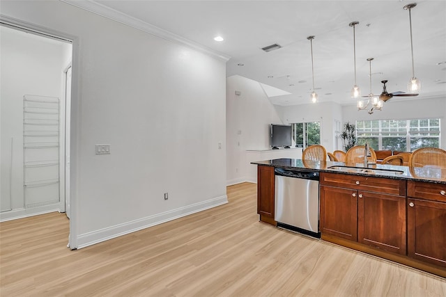 kitchen featuring dark stone counters, light hardwood / wood-style floors, dishwasher, and sink