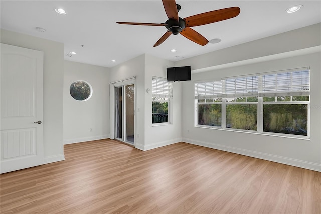 empty room featuring light hardwood / wood-style flooring and ceiling fan