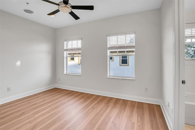 unfurnished room with light hardwood / wood-style flooring and ceiling fan