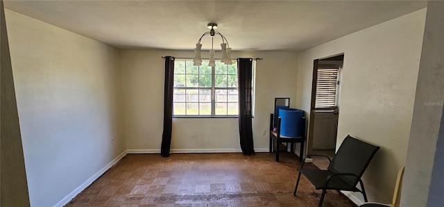 unfurnished room featuring baseboards