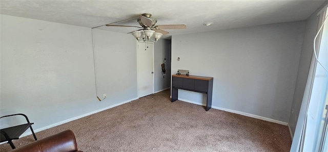 interior space featuring a ceiling fan, baseboards, and carpet floors