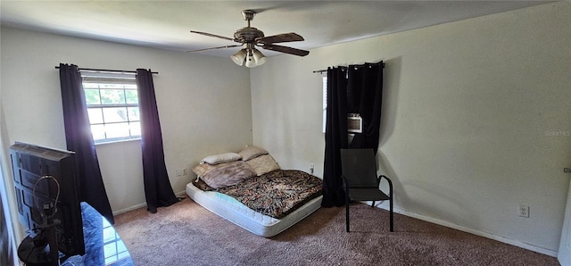 bedroom featuring carpet, baseboards, and ceiling fan