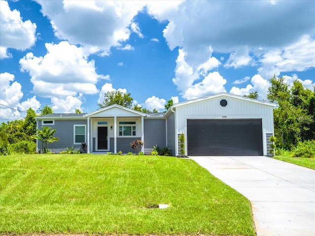 view of front of home with a front lawn and a garage