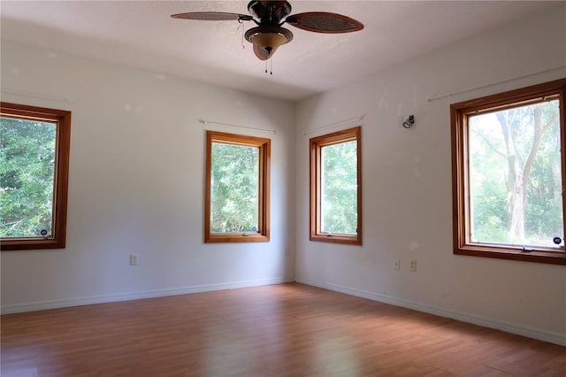 unfurnished room featuring wood-type flooring and ceiling fan