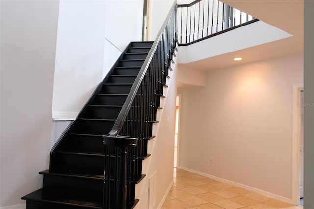 stairway with tile flooring