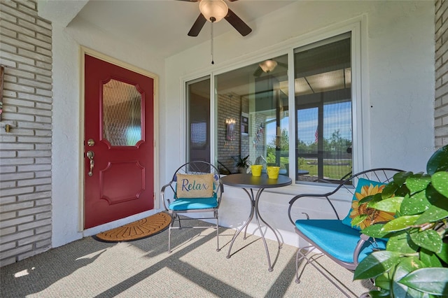 property entrance with a patio and ceiling fan