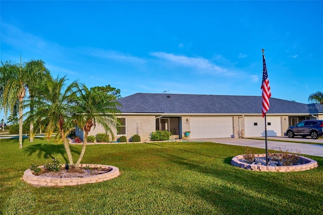 single story home with a garage and a front lawn