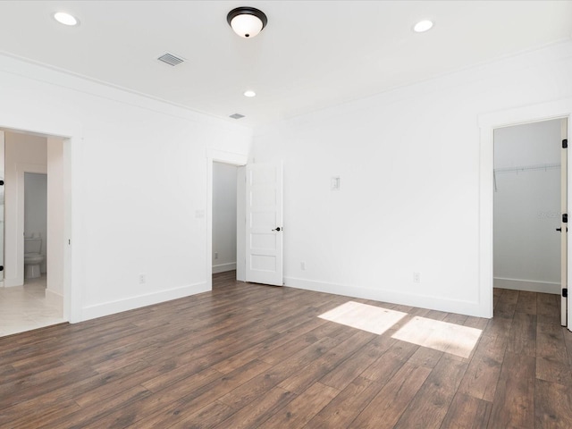 empty room featuring dark hardwood / wood-style floors