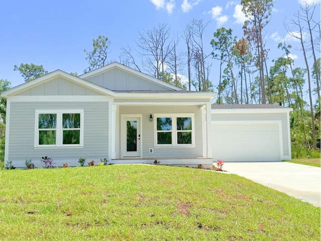 view of front of home featuring a garage and a front lawn