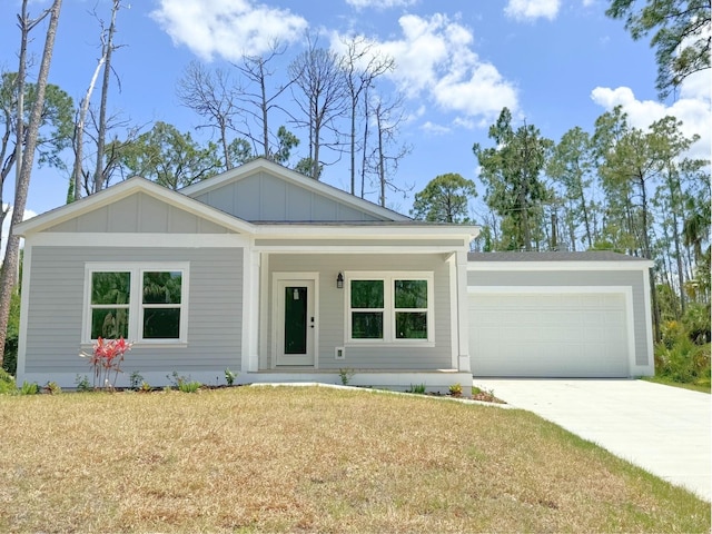 view of front of home with a garage and a front yard