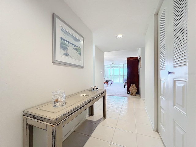 hallway with light colored carpet