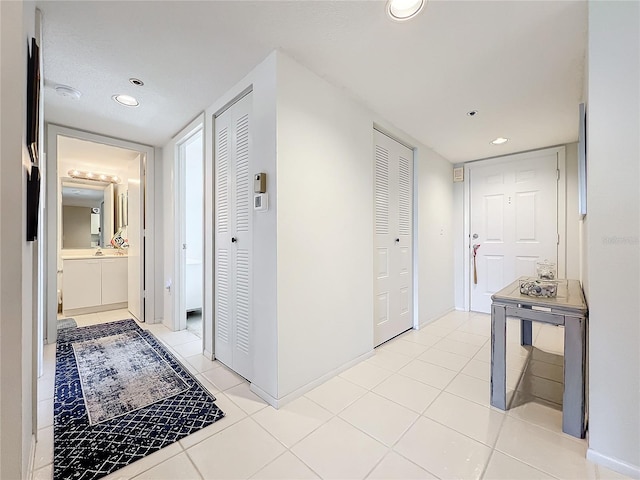 hallway with light tile flooring