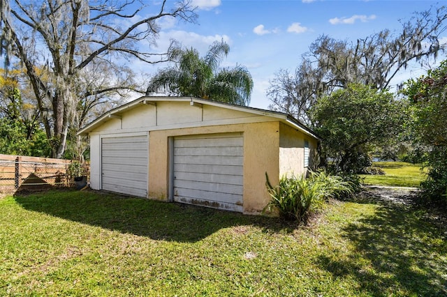 garage with a lawn