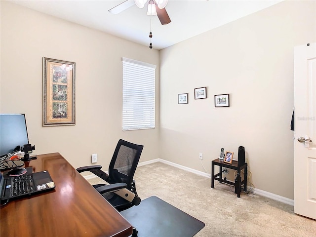 office space featuring light colored carpet and ceiling fan