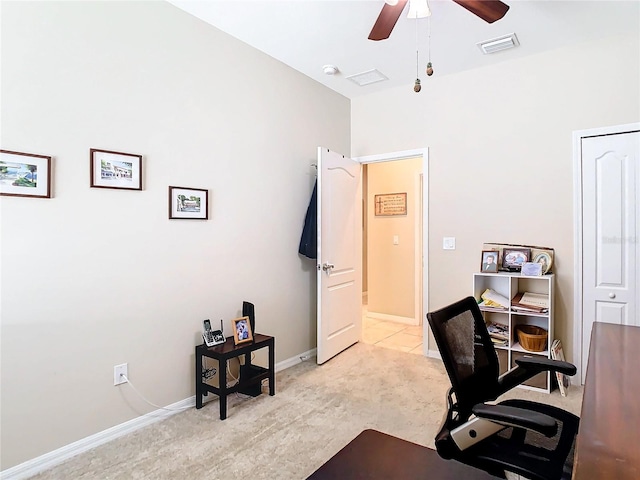 tiled home office with ceiling fan