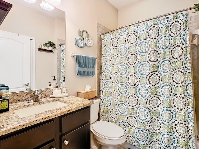 bathroom featuring toilet and oversized vanity