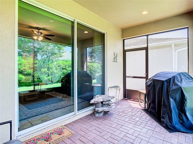 sunroom / solarium with ceiling fan