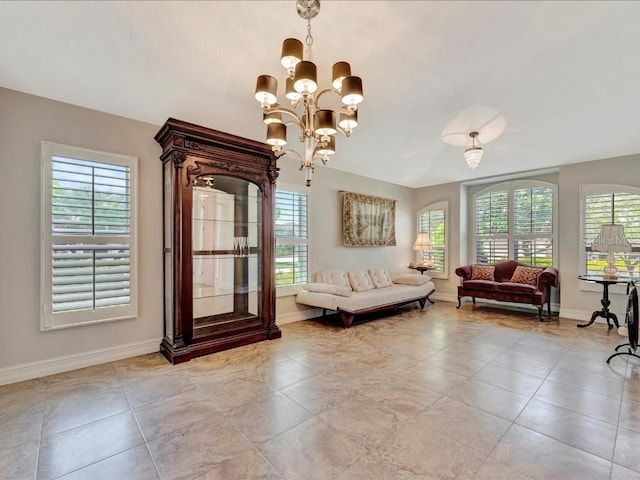 tiled living room featuring an inviting chandelier