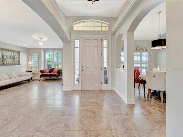 entryway with plenty of natural light and light tile floors